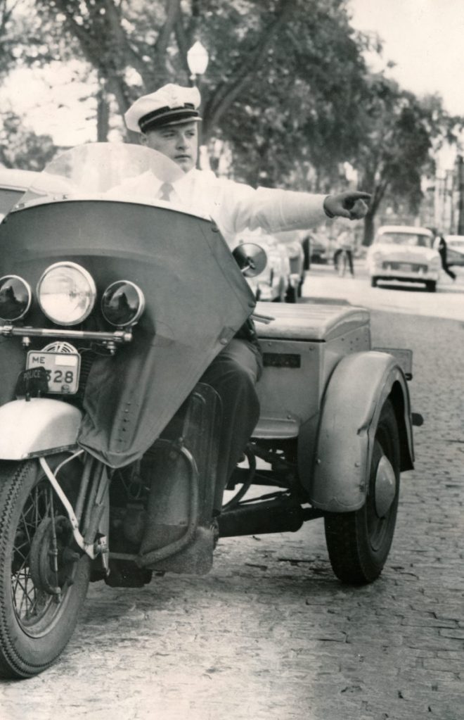 Herve Gendreau, a former chief with the Lewiston Police Department, rides a three-wheeler on Park St. in 1960 as part of the department's traffic division. Gendreau passed away on Friday at the age of 88. Submitted photo