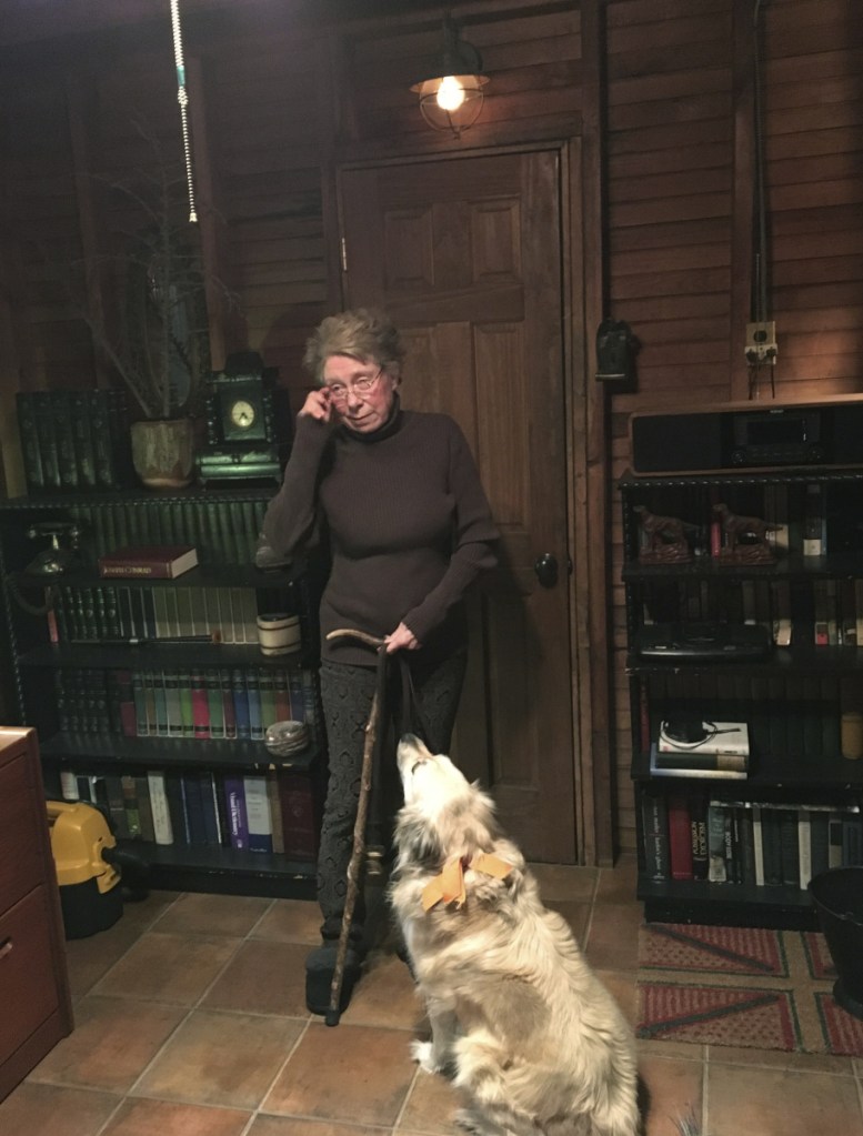 Susan Bush stands with her dog at her Pocono Pines, Pa., cottage. Bush has had several injuries while taking falls while walking her dog. A new study suggests broken bones from falls while dog-walking are on the rise among older adults and hip fractures are among the most common injuries.