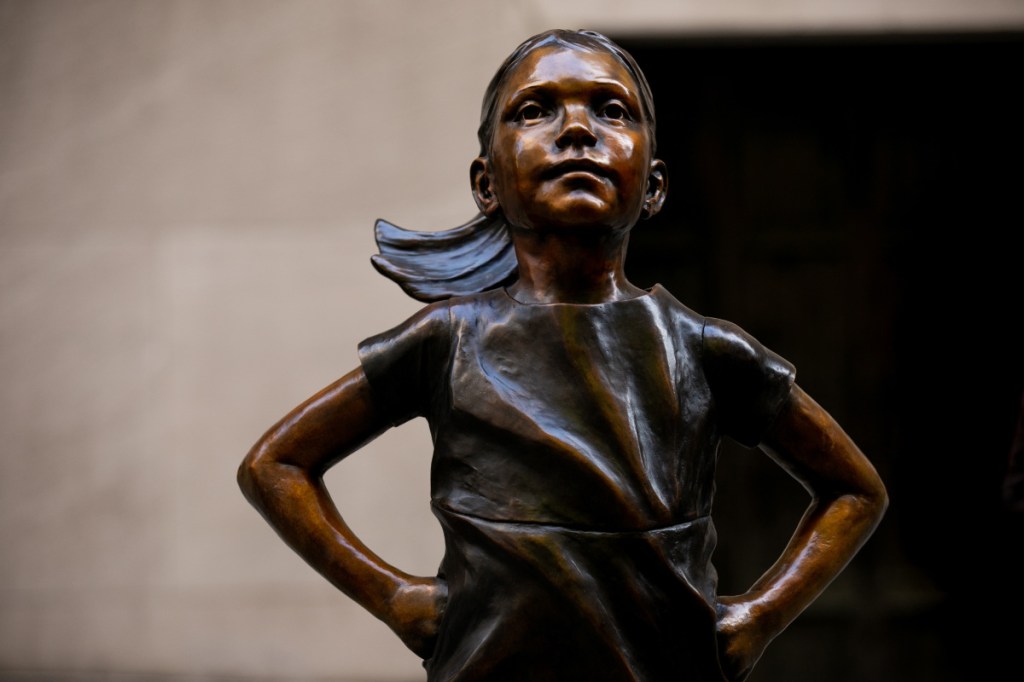 The "Fearless Girl" statue first appeared on Bowling Green across from the New York financial district's iconic statue of a charging bull. It was later moved in front of the New York Stock Exchange.