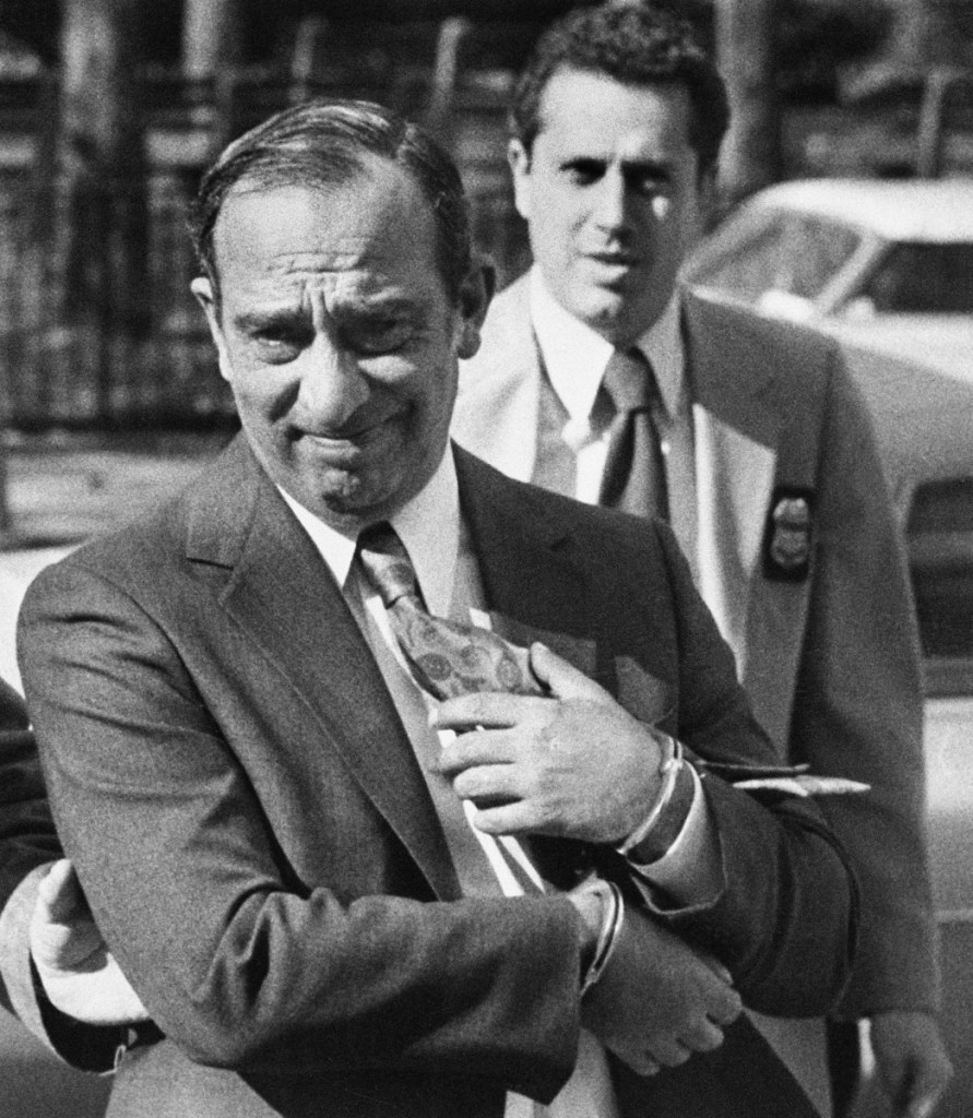 Colombo crime family boss Carmine Persico is led into court in handcuffs in New York in 1980. He died Thursday at the Duke University Medical Center.
