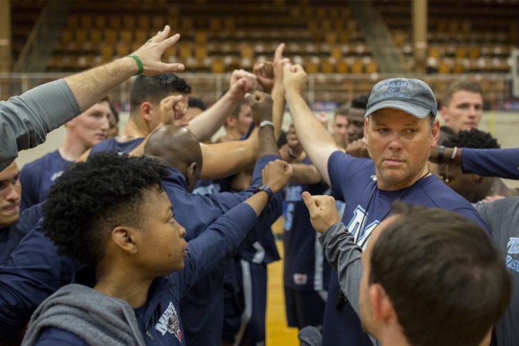 First-year UMaine men's basketball coach Richard Barron, right, thinks his team is heading in the right direction despite winning just five games this season.