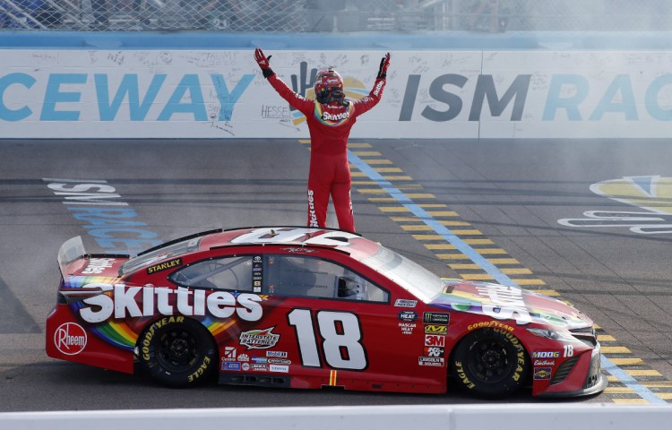 Kyle Busch acknowledges the fans after winning the Cup Series race Sunday in Avondale, Ariz. It's the 52nd career Cup Series win for Busch, and his 199th win overall, including the Xfinity and Truck Series.