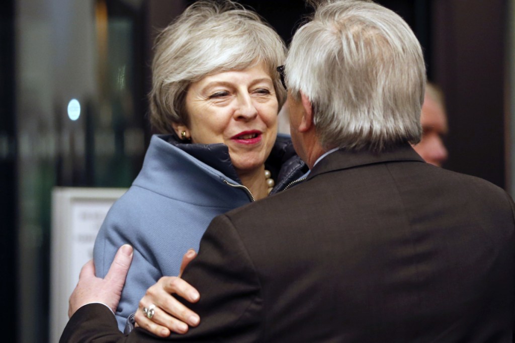 British Prime Minister Theresa May is welcomed by European Commission President Jean-Claude Juncker in Strasbourg, France, on Monday. May flew to Strasbourg to try to secure a last-minute Brexit deal with the bloc.