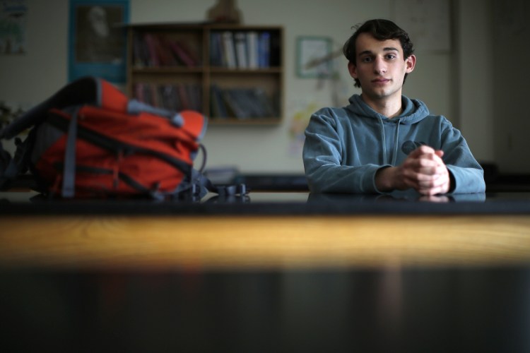 Matt Hogenauer, photographed in a biology classroom at Falmouth High School, takes arthritis medication that suppresses his immune system and makes him vulnerable to infectious disease. He caught pertussis a few years ago from unvaccinated children. He strongly supports a bill that would eliminate all non-medical exemptions for school-required vaccines.