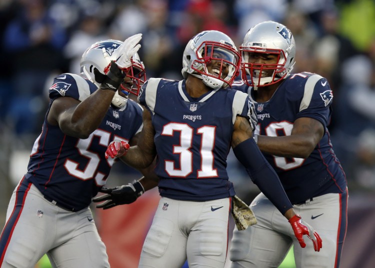 The Patriots placed a second-round tender on cornerback Jonathan Jones, center, which means if another teams signs him, it will need to compensate the Patriots with a second-round pick.