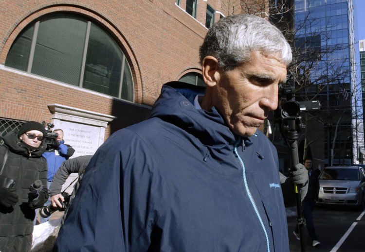 William "Rick" Singer founder of the Edge College & Career Network, departs federal court in Boston on Tuesday after he pleaded guilty to charges in a nationwide college admissions bribery scandal.