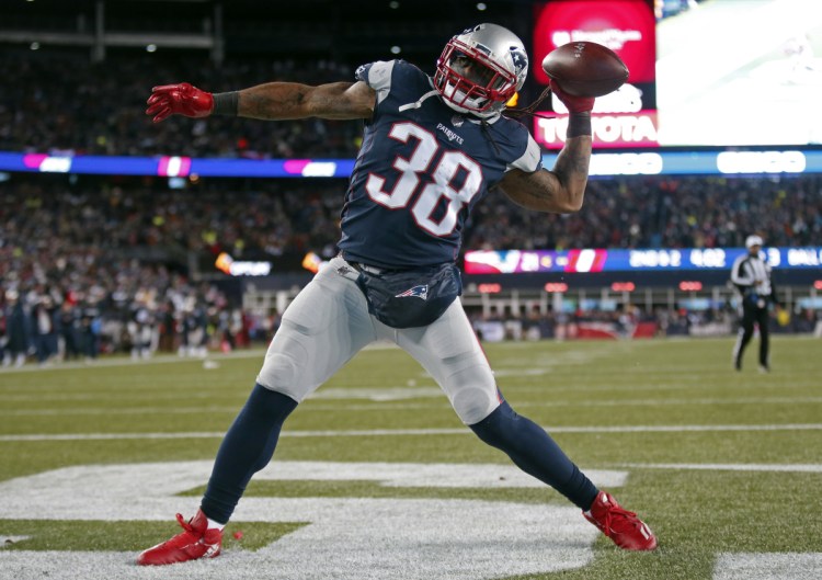 Brandon Bolden celebrates a touchdown against the Tennessee Titans during a NFL playoff game in January 2018 in Foxborough, Massachusetts. (AP Photo/Michael Dwyer)
