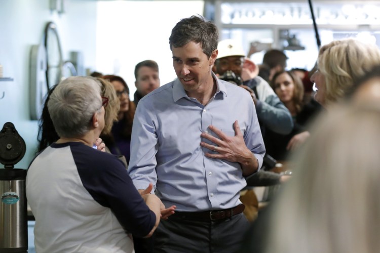 Former Texas congressman Beto O'Rourke greets employees at the Beancounter Coffeehouse & Drinkery this month in Burlington, Iowa.