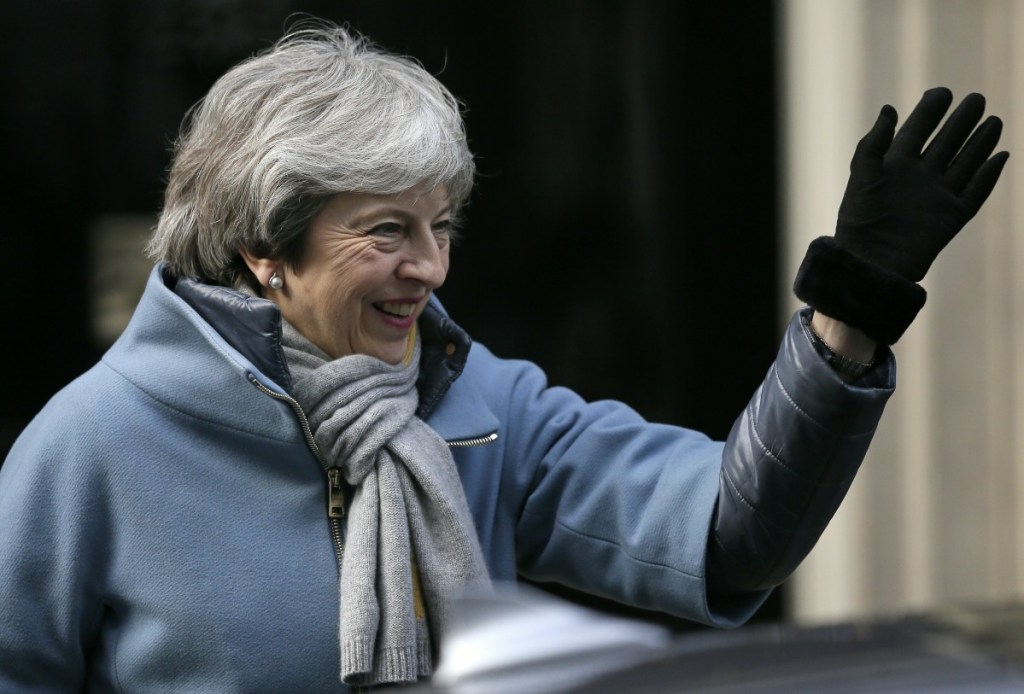 Britain's Prime Minister Theresa May leaves 10 Downing street in London on Thursday, when British lawmakers faced another tumultuous day dealing with the country's scheduled departure from the European Union and  May struggled to shore up her shattered authority.