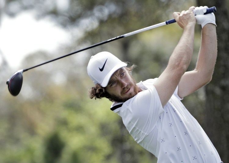 Tommy Fleetwood follows the ball after driving off the ninth tee Thursday during the opening round of The Players Championship. Fleetwood finished with a 65 and tied Keegan Bradley for the first-day lead.