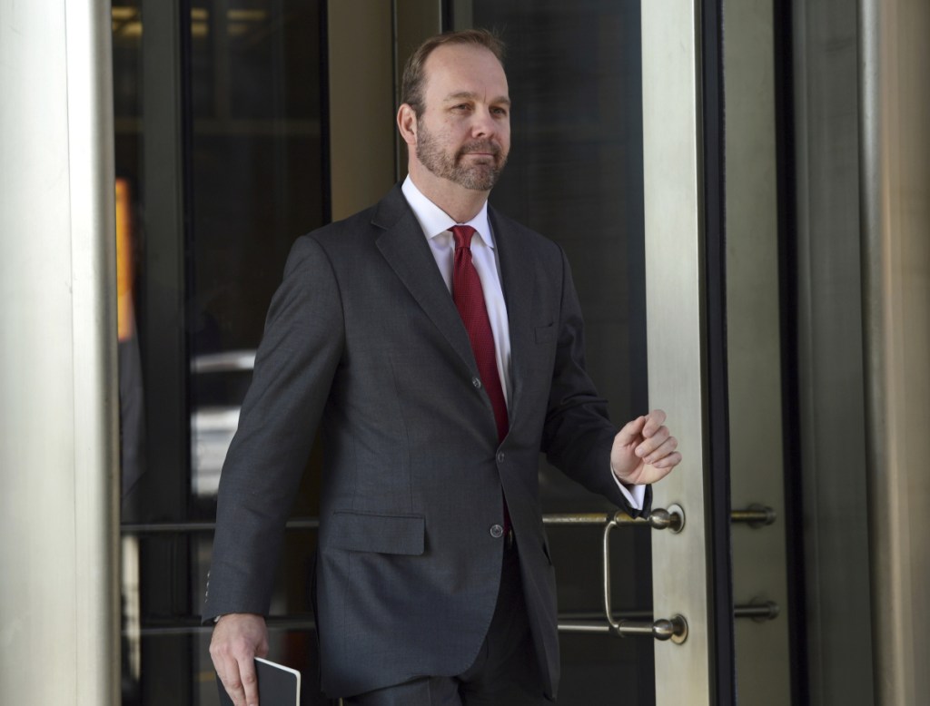 Former Trump campaign aide Rick Gates departs federal court in Washington in December 2017. Gates is not ready to be sentenced because he continues to help with "several ongoing investigations," prosecutors said in a court filing Friday.