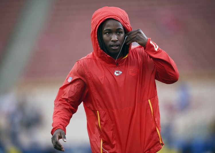 Then-Kansas City running back Kareem Hunt warms up before an NFL game against the Rams in Los Angeles. The NFL has suspended Hunt for eight games after a video showed him kicking a woman and he was later involved in a fight at a resort.