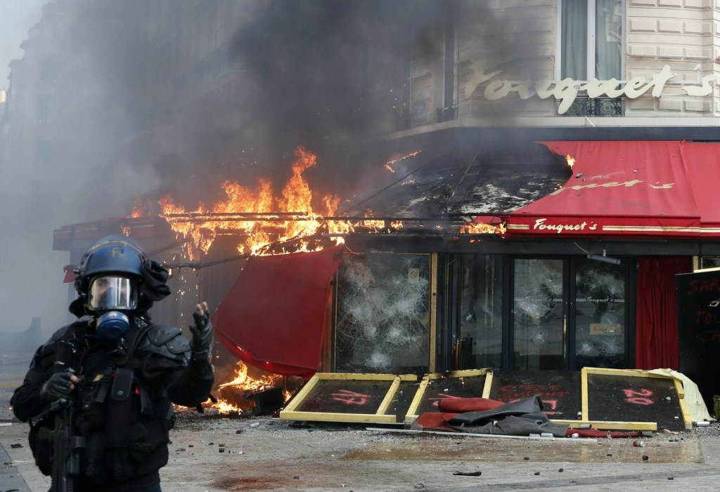 Paris' famed restaurant Fouquet's burns on the Champs Elysees avenue during a yellow vests demonstration Saturday.