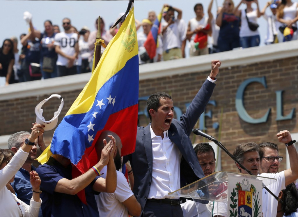 Venezuela's opposition leader and self-proclaimed interim president Juan Guaido sings the national anthem at the end of a rally in Valencia, Venezuela, on Saturday.
