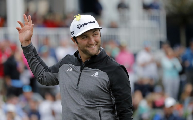 Jon Rahm, of Spain, waves to the gallery as he arrives at the 17th hole during the third round of The Players Championship on Saturday in Ponte Vedra Beach, Fla. (AP Photo/Gerald Herbert)