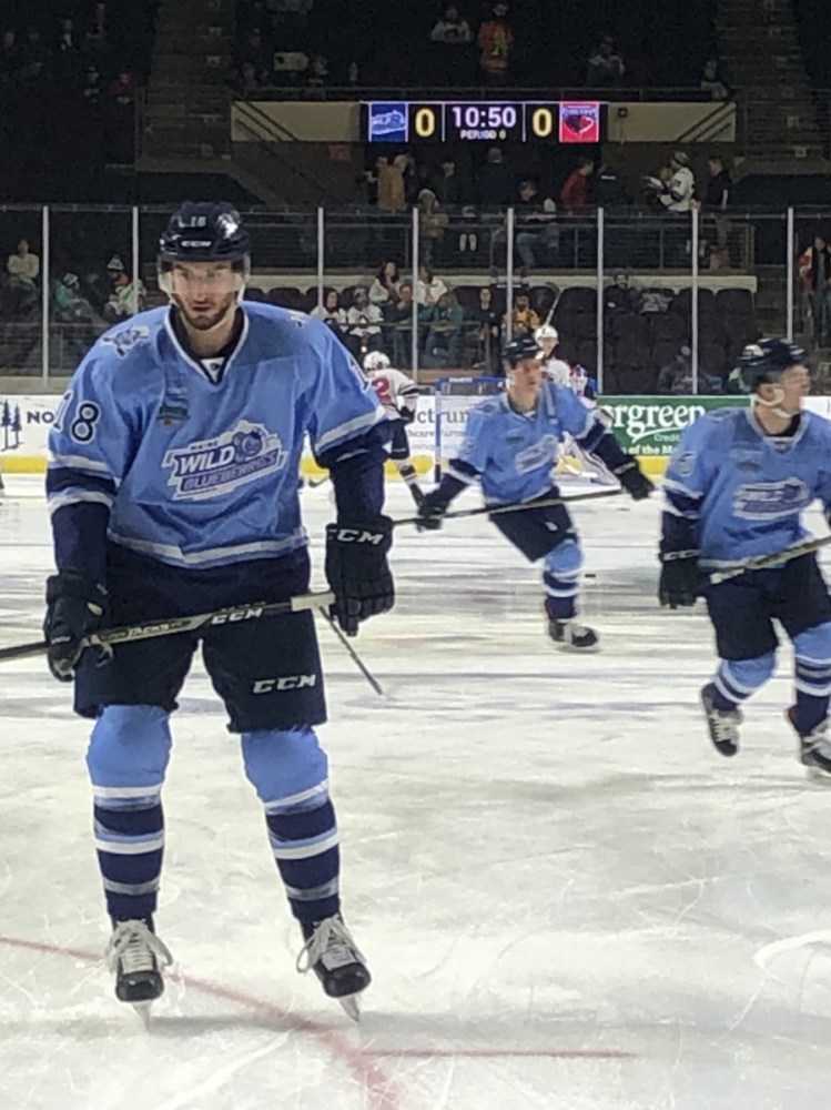 Ryan Ferrill, left, warms up with teammates before the March 9 game in Portland between the Maine Wild Blueberries and the visiting South Carolina Stingrays. It was the second-biggest night for merchandise sales for the Maine Mariners this season.
