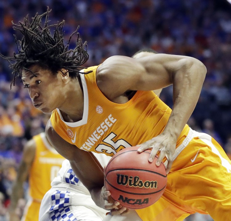 Tennessee forward Yves Pons drives against Kentucky in the first half of an NCAA college basketball game at the Southeastern Conference tournament Saturday, March 16, 2019, in Nashville, Tenn. ()