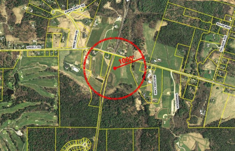 This visual shows a 1,000-foot radius around Cumberland's proposed relocation of its sand and salt sheds, and compost and brush areas. A rail line runs to the northwest of the Greely Road site, with Mustang Lane and the Twin Brook Recreation Area on the other side.