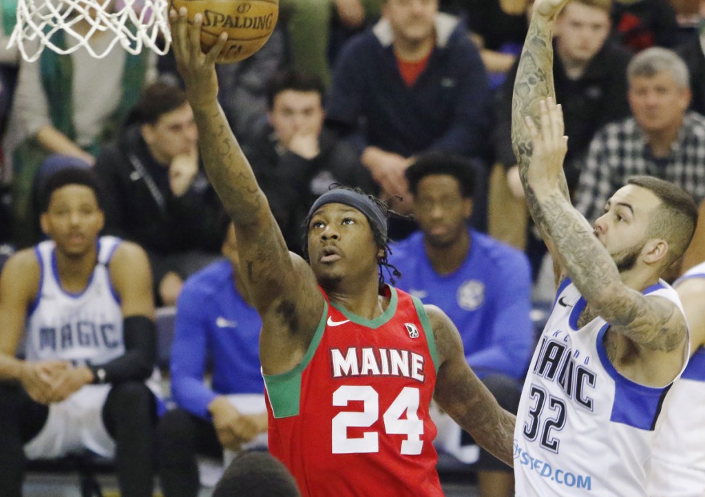 Archie Goodwin of the Maine Red Claws goes up for a shot Sunday past Gabe York of the Lakeland Magic in the first half of Lakeland's 112-103 win at the Portland Expo. The Claws, who are 19-28, will have three road games to end the season.