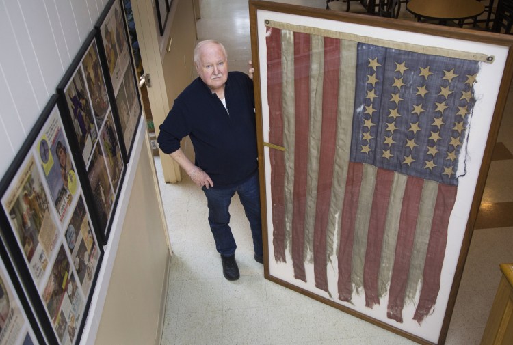 SOUTH PORTLAND, ME - MARCH 12: Lee Humiston of the Maine Military Museum receives flag from the Civil War that he says was the first to fly over Texas shores. The flag belonged to Major James H. Whitmore of the Fifteenth Maine Regiment. (Staff photo by Derek Davis/Staff Photographer)