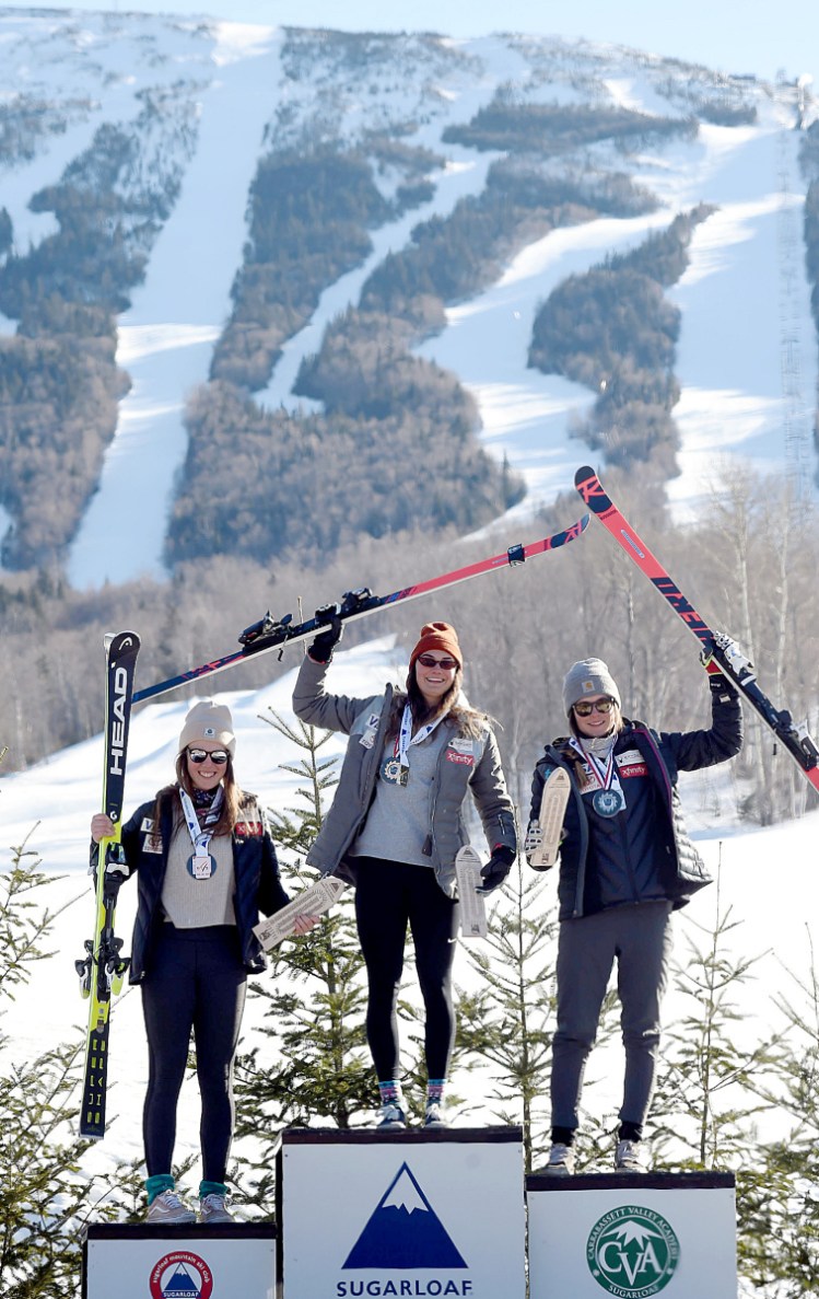 Alice Merryweather, center, won the women's downhill championship Tuesday at Sugarloaf. Keely Cashman, right, came in second and AJ Hurt, left, took third.
Story, Page D5