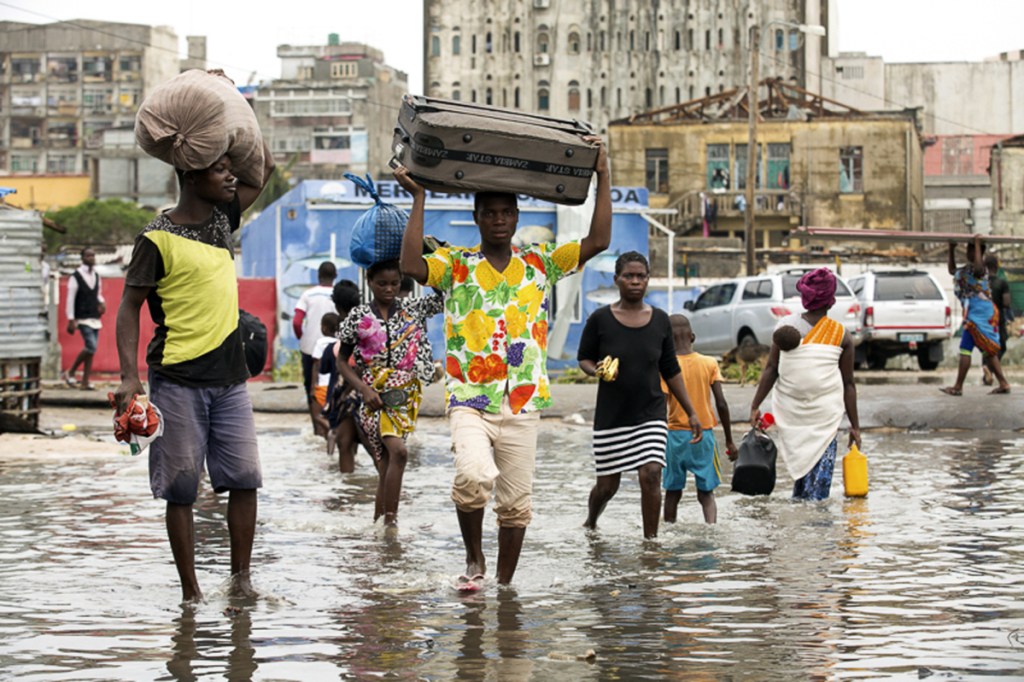 People head for higher ground in Beira, Mozambique, on Friday after Cyclone Idai made landfall. The storm was considered by some to be the worst in more than 20 years.