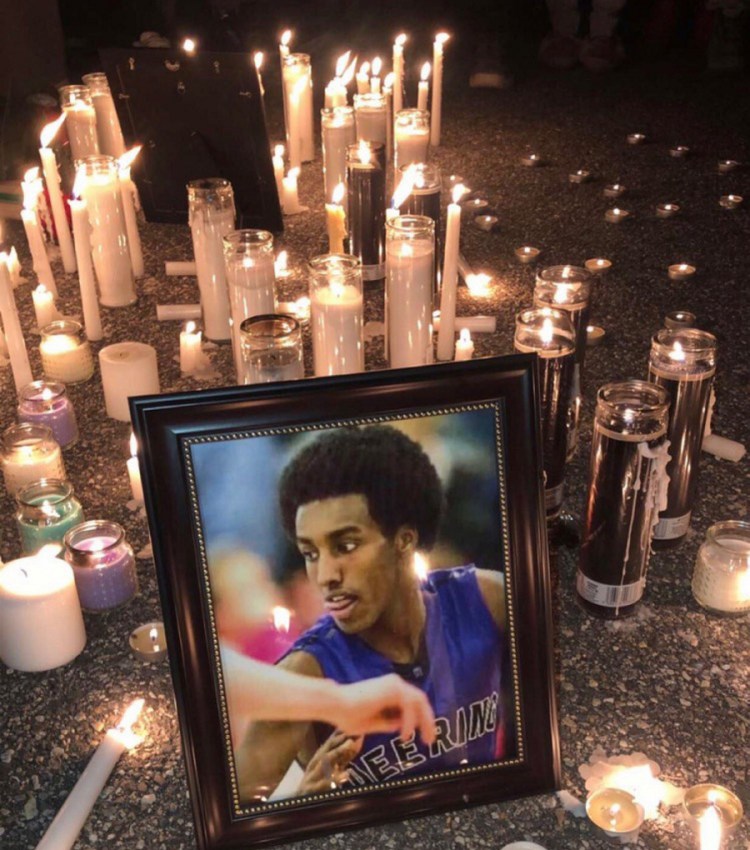 A vigil was held for Isahak Muse on Tuesday night at the Townhomes at Ocean East apartments in Portland. Muse was shot during an altercation at 1:45 a.m. at 107 Milton St. on Saturday and was dead when police arrived.