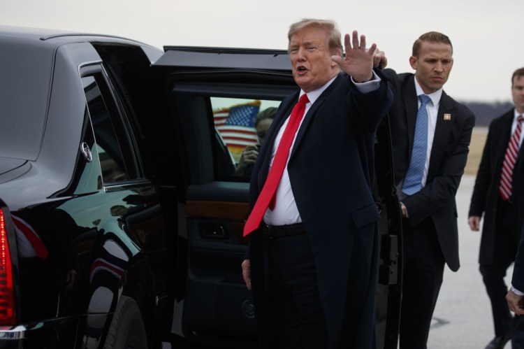 President  Trump waves as he gets into his vehicle after arriving at Akron-Canton Airport for a fundraiser on Wednesday.