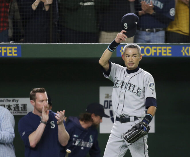 Ichiro Suzuki waves to spectators while leaving the field for defensive substitution in the eighth inning Thursday at Tokyo Dome. Suzuki announced his retirement after the game between the Seattle Mariners and Oakland Athletics. (AP Photo/Koji Sasahara)
