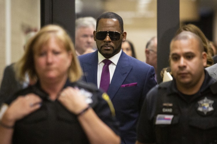 R. Kelly leaves a court appearance in Chicago on Monday.