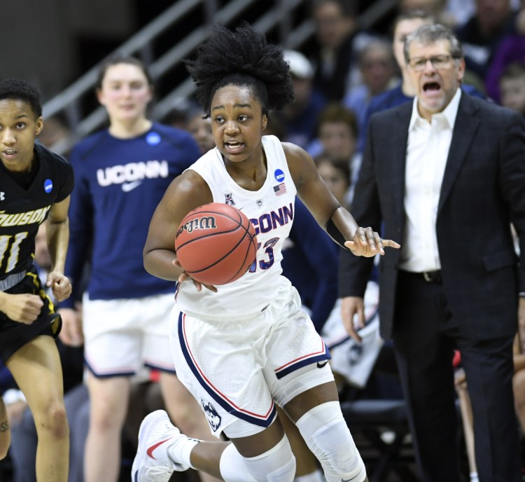 Connecticut's Christyn Williams scored 21 points Friday night, leading the Huskies to their 26th straight first-round win, 110-61 over Towson.