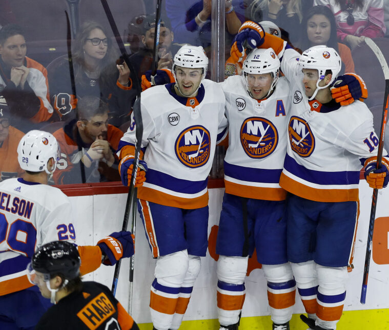 New York Islanders, from right, Andrew Ladd, Josh Bailey, Adam Pelech and Brock Nelson celebrate after Bailey's goal during Saturday game in Philadelphia. New York won 4-2.