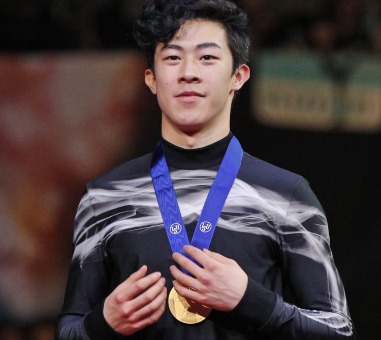 Nathan Chen from the U.S. stands on the podium with the gold medal for the men's free skating routine during the ISU World Figure Skating Championships at Saitama Super Arena in Saitama on Saturday.