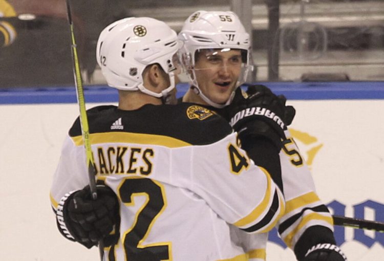 Noel Acciari, right, celebrates with Boston teammate David Backes, left, after scoring a goal against the Florida Panthers in the first period on Saturday in Sunrise, Fla.