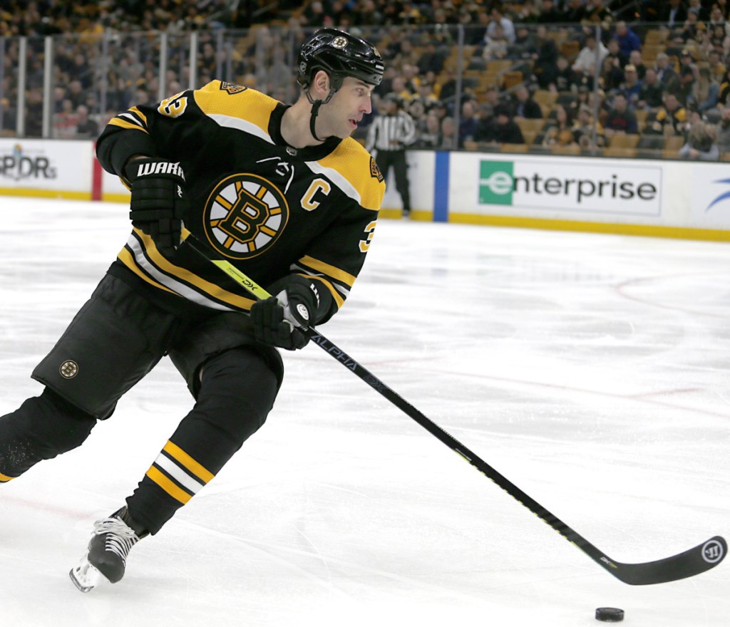 Defenseman Zdeno Chara, who scored his 200th career goal Saturday night, will be staying with the Bruins for at least one more season.