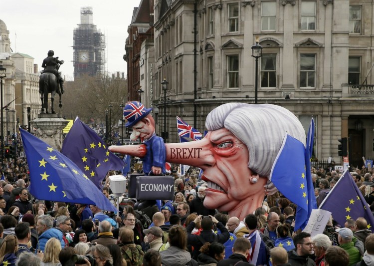 An effigy of British Prime Minister Theresa May is wheeled through Trafalgar Square during a Peoples Vote anti-Brexit march in London on Saturday. 