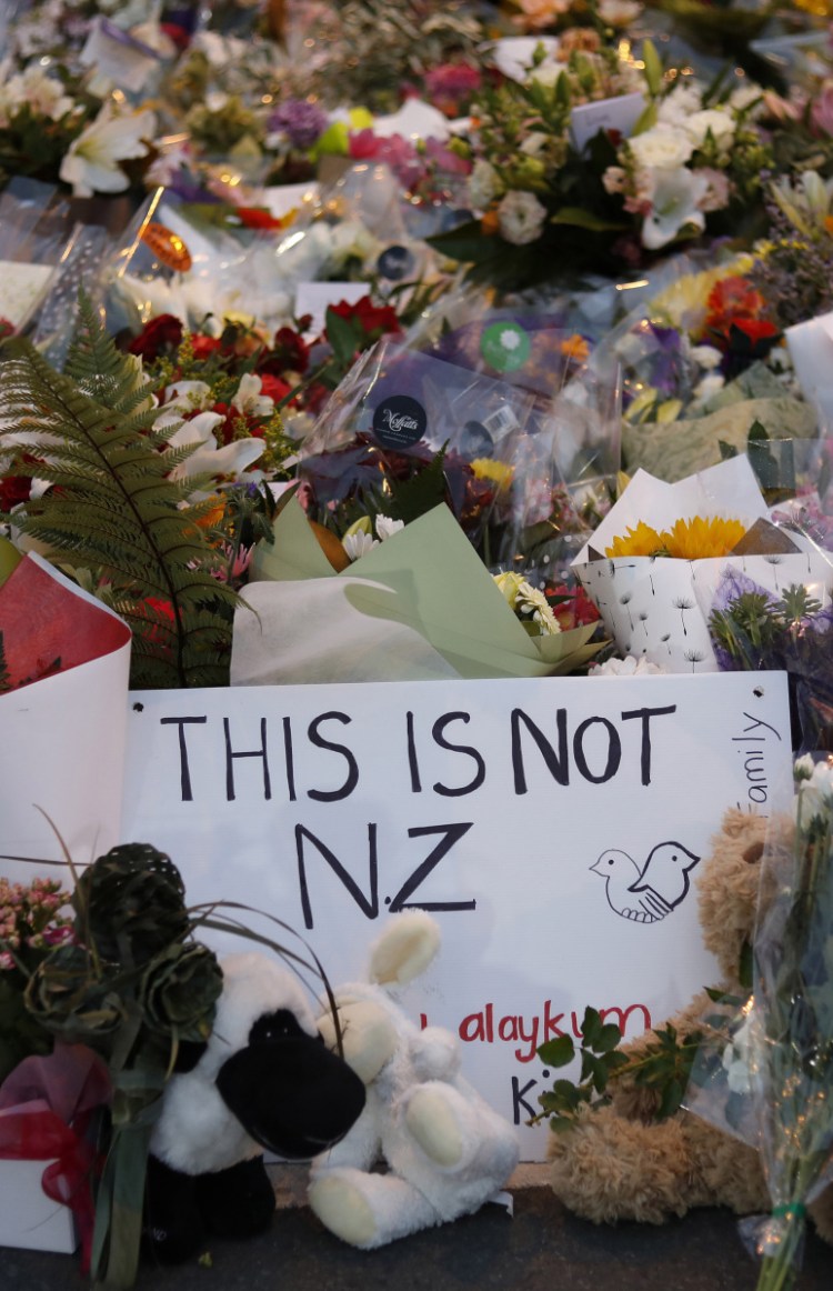 Flowers lie at a memorial near a Christchurch, New Zealand, mosque. New Zealanders are debating the limits of free speech after their chief censor banned a manifesto written by the massacre suspect.