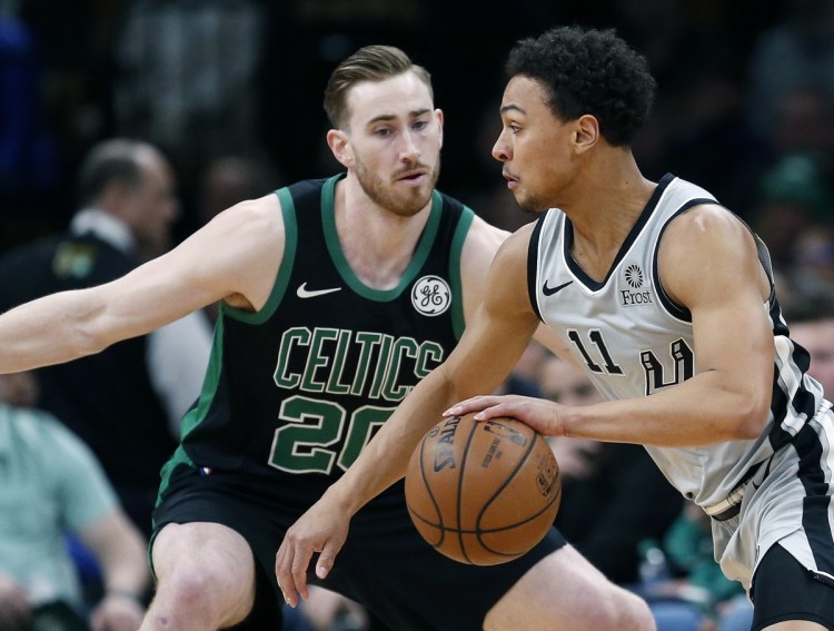Gordon Hayward of the Celtics defends San Antonio's Bryn Forbes during Sunday's game in Boston. The Celtics suffered their fourth straight loss, 115-96.