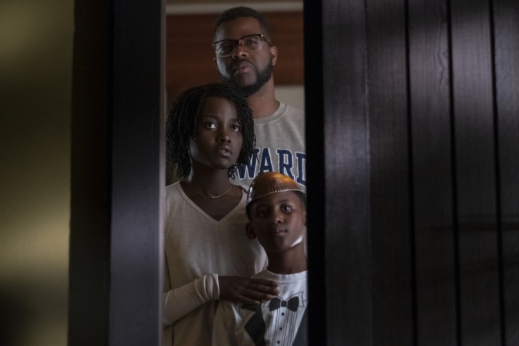Winston Duke, Lupita Nyong'o and Evan Alex in a scene from "Us," written, produced and directed by Jordan Peele.