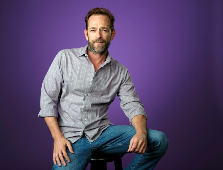  In this Aug. 6, 2018, file photo, Luke Perry, a cast member in the CW series "Riverdale," poses for a portrait during the 2018 Television Critics Association Summer Press Tour in Beverly Hills, Calif. Perry died Monday at the age of 52 after suffering a stroke.