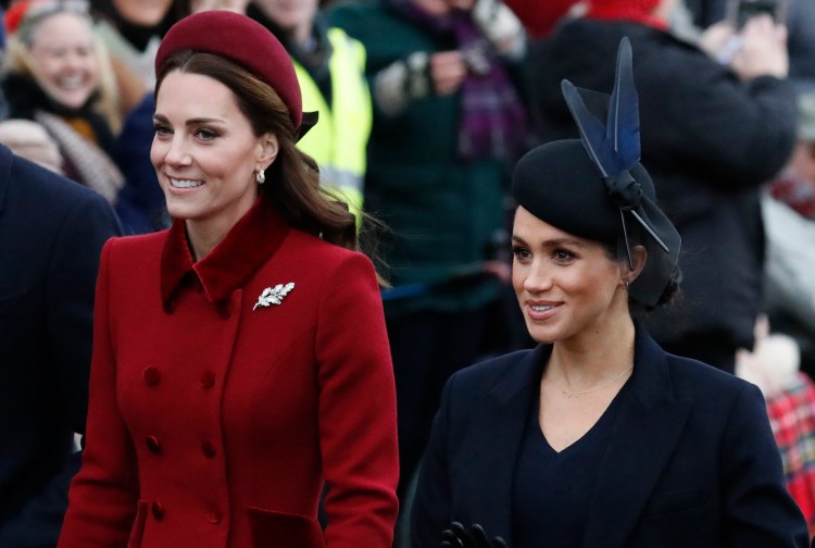 In this Tuesday, Dec. 25, 2018 file photo, Britain's Kate, Duchess of Cambridge, left, and Meghan, Duchess of Sussex arrive to attend the Christmas day service at St Mary Magdalene Church in Sandringham in Norfolk, England. Britain’s royal family is warning that it will block trolls posting offensive messages on its social media channels _ and may report offenders to the police. Buckingham Palace, Clarence House and Kensington Palace issued new guidelines on Monday, March 4, 2019 spelling out the policy banning offensive, hateful and racist language.