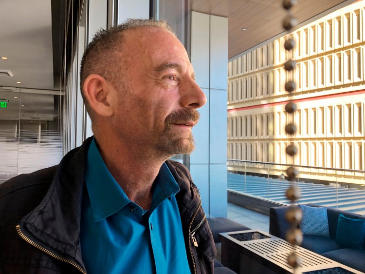 Timothy Ray Brown poses for a photograph, Monday, March 4, 2019, in Seattle. Brown, also known as the "Berlin patient," was the first person to be cured of HIV infection, more than a decade ago. Now researchers are reporting a second patient has lived 18 months after stopping HIV treatment without sign of the virus following a stem-cell transplant. But such transplants are dangerous, cannot be used widely and have failed in other patients. 