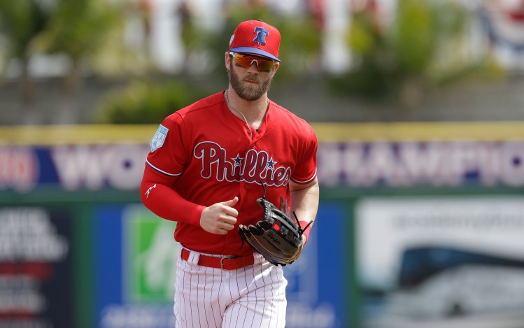 Harper plays in outfield for Phillies for first time
