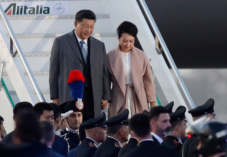 Chinese President Xi Jinping and his wife, Peng Liyuan, arrive at Rome's Leonardo Da Vinci airport in Fiumicino, Italy, on Thursday. Jinping is in Italy to sign a memorandum of understanding to make Italy the first Group of Seven leading democracies to join China's ambitious Belt and Road infrastructure project.