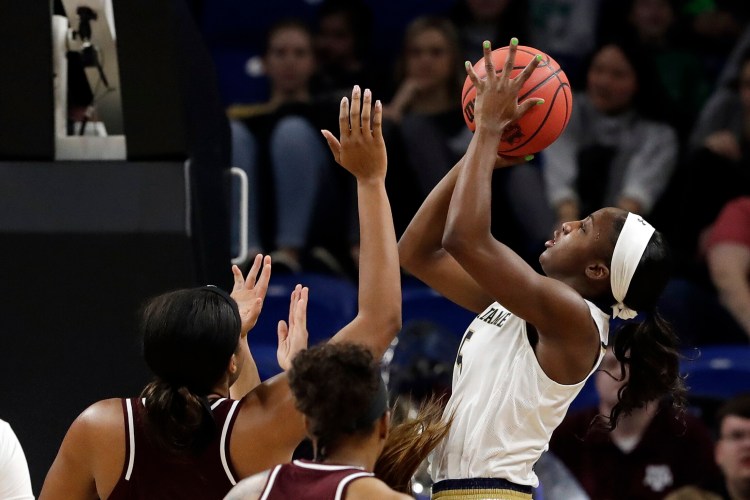 Notre Dame's Jackie Young goes up for a shot in the first half of a regional semifinal Saturday against Texas A&M. Notre Dame, the defending national champion, advanced to the Elite Eight with an 87-80 win.