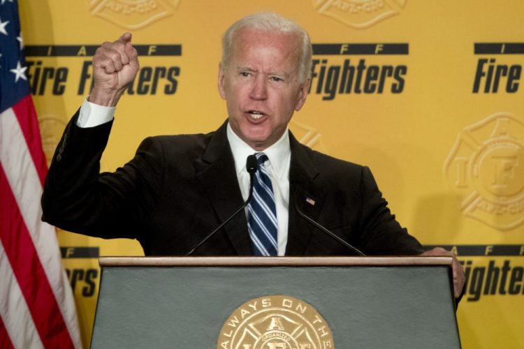 Former Vice President Joe Biden, shown March 12 ,  says he does not recall kissing a Nevada political candidate on the back of her head in 2014.  