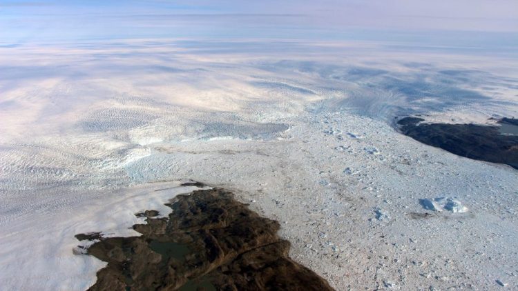 This 2016 photo provided by NASA shows patches of bare land at the Jakobshavn glacier in Greenland. The major Greenland glacier, which was one of the fastest-shrinking ice and snow masses on Earth, is growing again, a new NASA study finds
