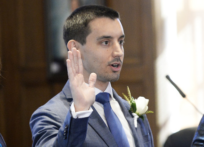 Portland City Councilor Justin Costa, shown being sworn in December 2017, is a candidate for mayor.