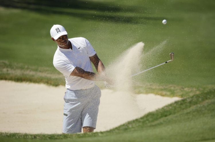 Tiger Woods plays a shot from a bunker on the 16th hole during a practice round at the Dell Match Play Championship golf tournamen on Tuesday at Austin, Tex.