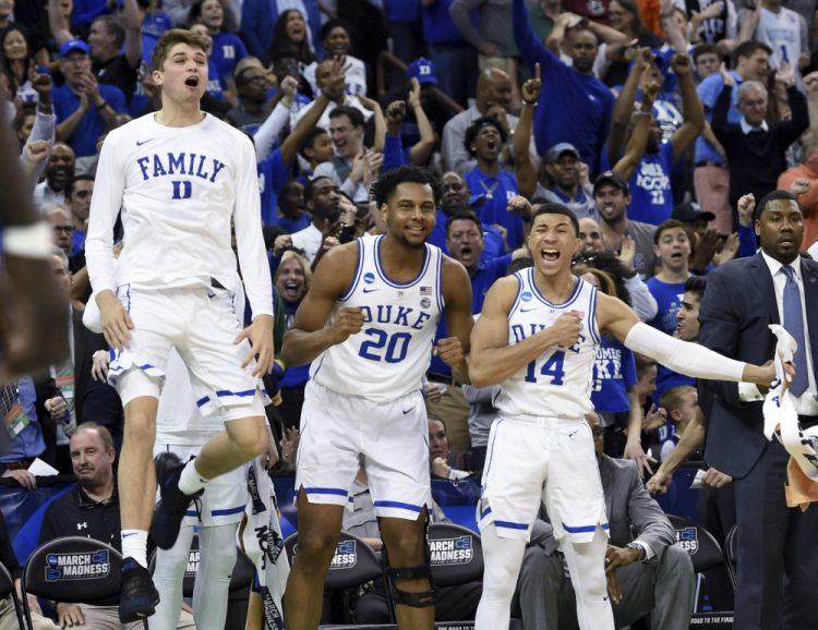 Duke's bench reacts to a play during the second half of the team's second-round men's college basketball game against Central Florida in the NCAA Tournament in Columbia, S.C. Sunday, March 24, 2019. (AP Photo/Richard Shiro)